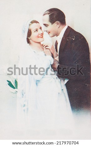 POLAND, WARSAW - CIRCA 1950 : old photo  of pretty young  couple of woman and man  in wedding dress  Illustrative Image, subject of human interest.
