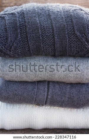 stack of folded woolen clothes close up