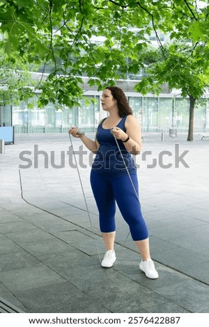 Similar – Image, Stock Photo Sportswoman with curvy body stretching leg on urban pavement