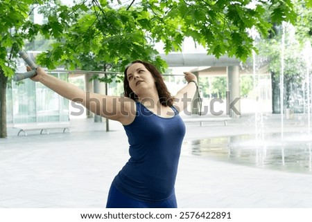 Similar – Image, Stock Photo Sportswoman with curvy body stretching leg on urban pavement