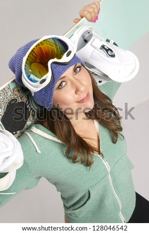 Snowboard and Fun Loving Smiling Female in Teal with all her gear