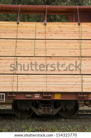 Lumber loaded on railcar for delivery railroad train transportation