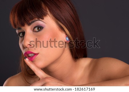 Beautiful woman asks for silence in head and shoulders pose