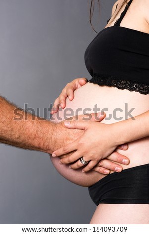 Man Woman Partners Expecting Baby Both Touch Hands Pregnant Stomach