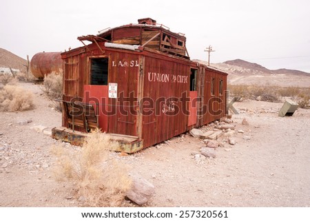 RHYOLITE, NEVADA/UNITED STATES - NOVEMBER 19: An old railroad caboose sits abandoned now a tourist attraction in Death Valley November, 2014.