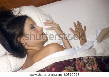 Woman in Bed Sleeping Soundly Head on Pillow Under Comforter