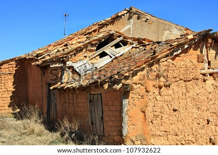 mud houses in ruins of an abandoned village