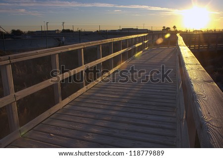 Boardwalk to Winter Beach at sunset