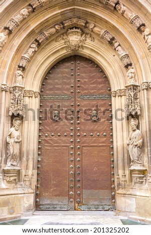 old wooden door with iron ornaments