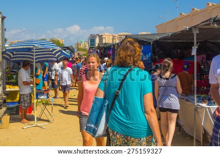 Murcia, Spain August 23, 2014: Market Street typical crowded summer and various articles on August 23, 2014 in Murcia, Spain