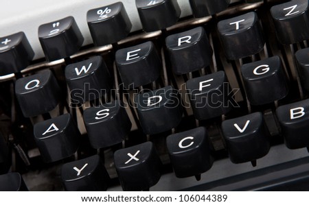 letters and keyboard of silver shiny typewriter