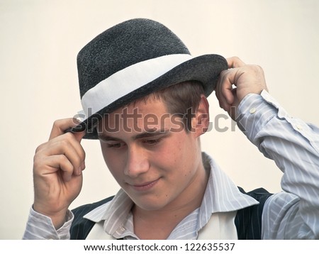 portrait of young man in a hat - retro style