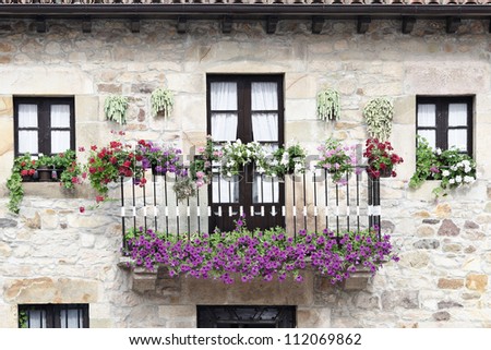 balcony decorated with flowers in the village of Lierganes, Cantabria, Spain
