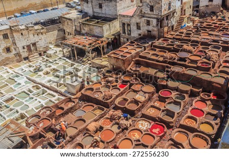 Tannery tanks in Fes, Morocco, filled with tanning and dying solution for leather