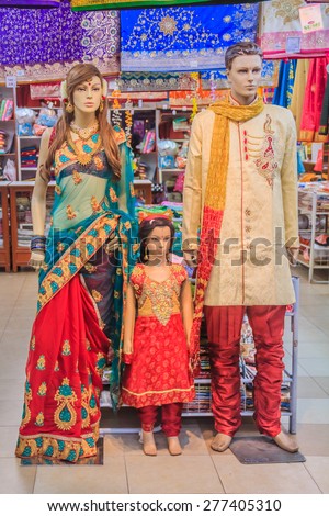 Mannequin family dressed in traditional Indian colorful clothing at the sari street market in Penang, Malaysia