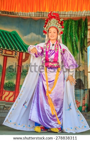 Georgetown, Penang, Malaysia - August 23, 2013: Chinese opera actors performming a public show. Chinese opera orginated in the Tang dynasty cira 720 AD.