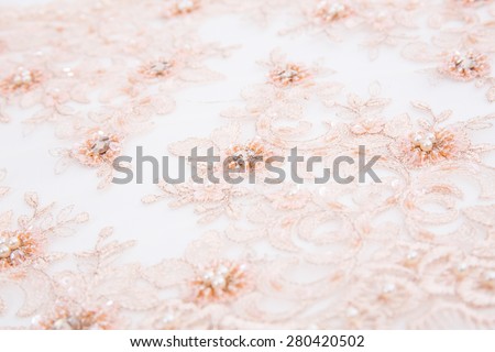 pink lace cloth on white background