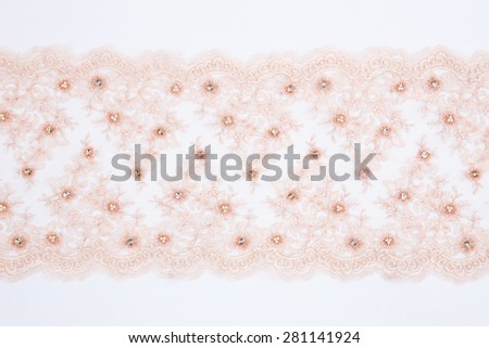 pink lace cloth on white background