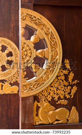 Deer carved gold paint on temple door