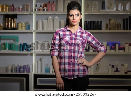 Young woman in cosmetics shop