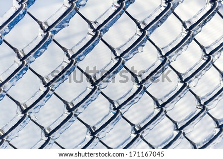 Ice covered chain link fence from a severe ice storm.