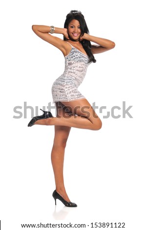Beautiful black woman wearing a short dress and high heels isolated on a white background