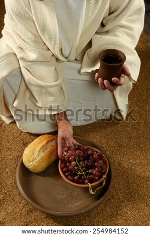 Jesus with bread wine and grapes on a vertical format