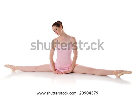 Ballerina resting on the floor against a white background