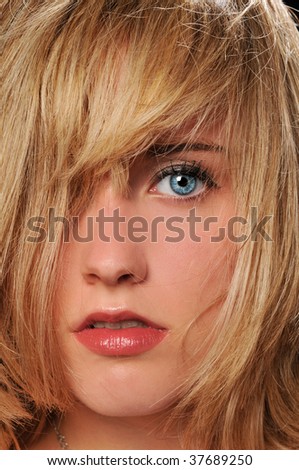 Portrait of young woman close up with blue eyes