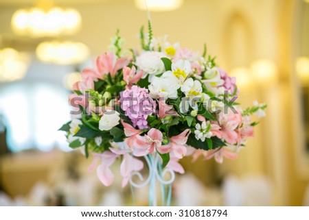Beautiful wedding table decoration, flower arrangement and candles, a banquet for the guests
