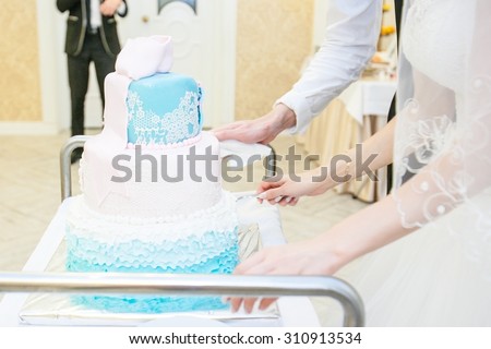 Beautiful white wedding cake with blue, the completion of the wedding banquet