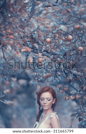 A mysterious woman in the apple garden, mysterious atmosphere
