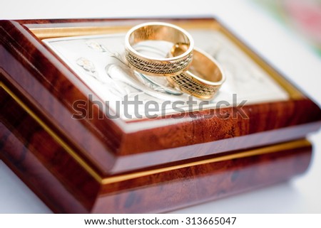 Wedding ring in a wooden box, a necessary attribute of the bride and groom