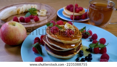 Similar – Image, Stock Photo Honey pouring over fried toasts with fruit