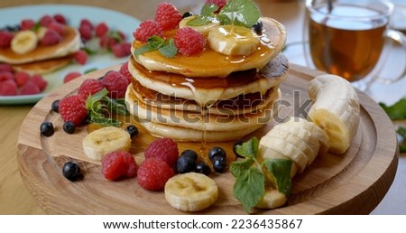 Similar – Image, Stock Photo Honey pouring over fried toasts with fruit