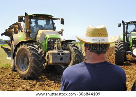 CENTRAL ITALY- JUNE 23: Agricultural fair with free admission, including displays of tractors and agricultural machinery, crowded with farmers and landowners. June 23, 2013 in Latina, Central Italy