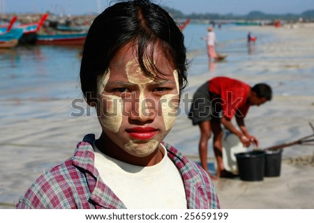 NGAPALI FISHING VILLAGE, MYANMAR - JANUARY 06: Burmese woman with traditional Tanaka  January 6, 2009 in Ngapali fishing village, Myanmar