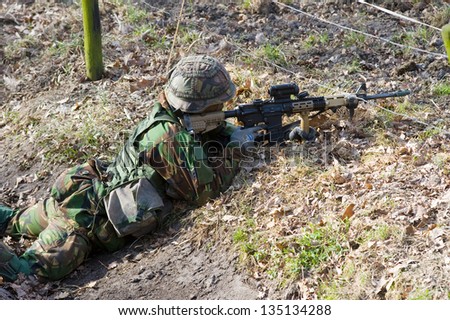 A soldier lying on the ground during a training