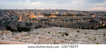 The temple mount and the graves from the mount of olives in front in the twilight in Jerusalem