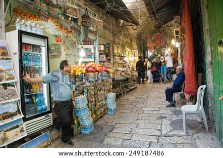 JERUSALEM, ISRAEL - OCTOBER 07, 2014: All kinds of shops in one of the small streets in the old city of Jerusalem