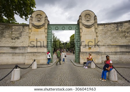 PARIS, FRANCE - JULY 27, 2015: The entrance on Boulevard De Menilmontant of cemetery Pere Lachaise in Paris in France. The cemetery is popular by tourists.
