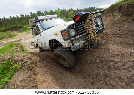 FURSTENAU, GERMANY - MAY 09, 2015: A Toyota 4-wheel drive is driving on a special off the road terrain for land cruisers and vehicles in Germany
