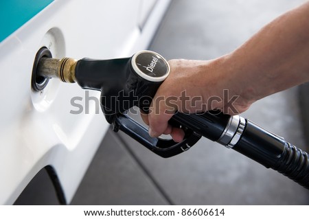 A man filling his tank with diesel