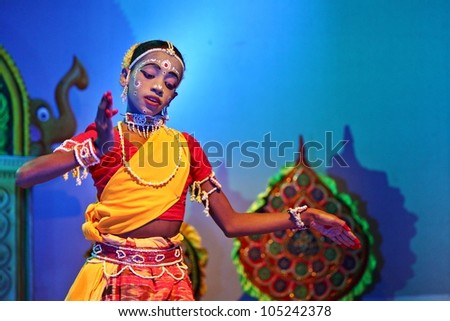ORISSA, INDIA - NOV 17: A 8 year old boy, named as Vasant, dances in Gotipua festival November 17, 2011 at Orissa, India. Gotipua is a form of folk Odissi dance.