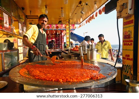 MUMBAI,INDIA-APRIL 04:Indian street vendor make fast food at Juhu beach in Mumbai,India on April 04,2015.