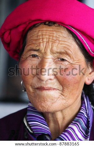 ANDHRA PRADESH, INDIA - OCTOBER 27: An old unidentified Tibetan lady, in traditional Tibetan clothing, visits India on October 27, 2011 at Nagarjuna Sagar, Andhra Pradesh, India.