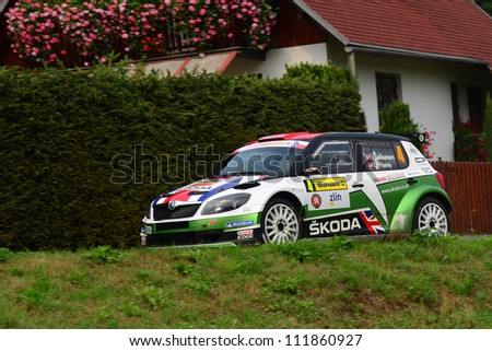 ZLIN,CZECH REP.-SEPTEMBER 2. Driver and Mikkelsen and co-driver Floene with car Skoda Fabia S2000 at Barum Rally event,speed check Nr 13.September 2. 2012 in Zlin,Czech republic.