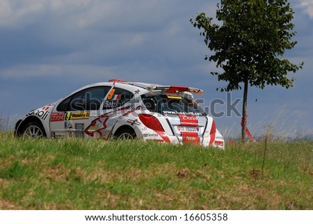 ZLIN,CZECH REP.-AUGUST 24.Driver Luca Betti and co-driver Maurizio Barone with car Peugeot 207 s2000 at Barum Rally event,speed check Nr.12 August 23.2008 in Zlin,Czech republic.