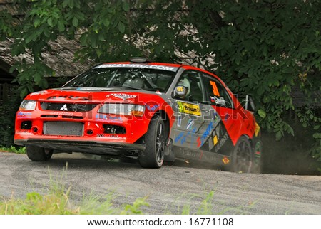 ZLIN,CZECH REP.-AUGUST 23.Driver Peter Gavlak and co-driver Milos Hulka with car Mitsubishe Lancer at Barum Rally event,speed check Nr.9 August 23.2008 in Zlin,Czech republic.