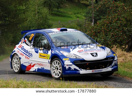 ZLIN,CZECH REP.-AUGUST 23.Driver P.VALOUSEK and co-driver Z.HRUZA with car Peugeot 207 s 2000 at Barum Rally event,speed check Nr.2 August 23.2008 in Zlin,Czech republic.